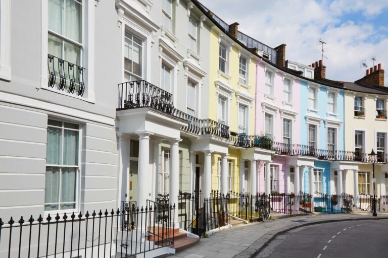 a row of pastel coloured houses, representing probate home insurance